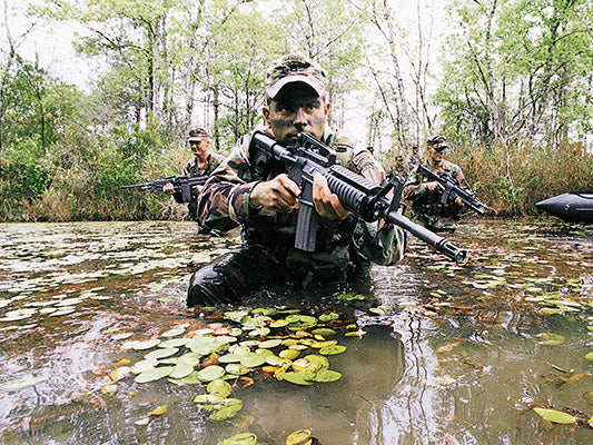 Elite U.S. Army Rangers traverse a swamp