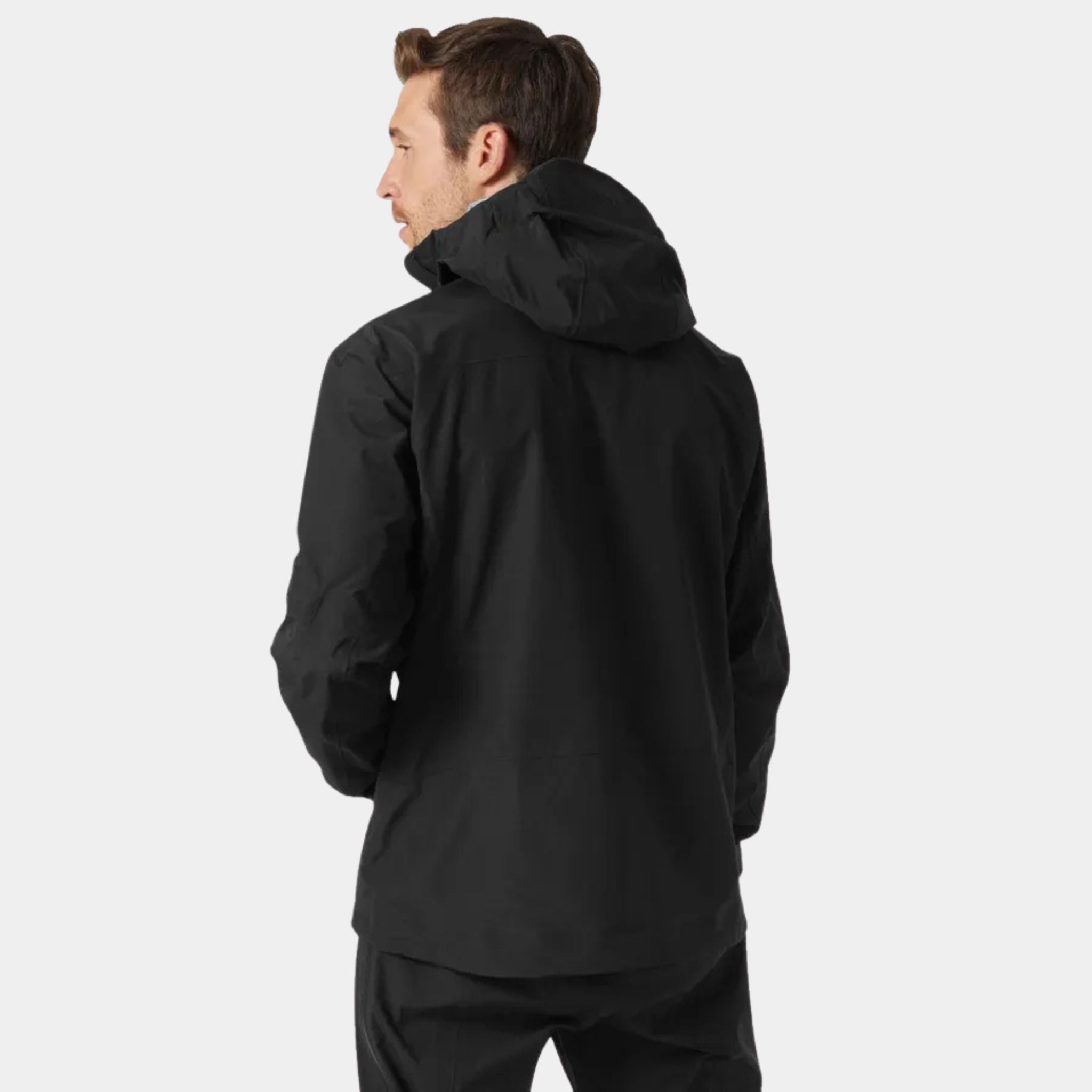 Back view of a Male Model wearing the Helly Hansen Odin 9 Worlds 3.0 Hard Shell Jacket in Black