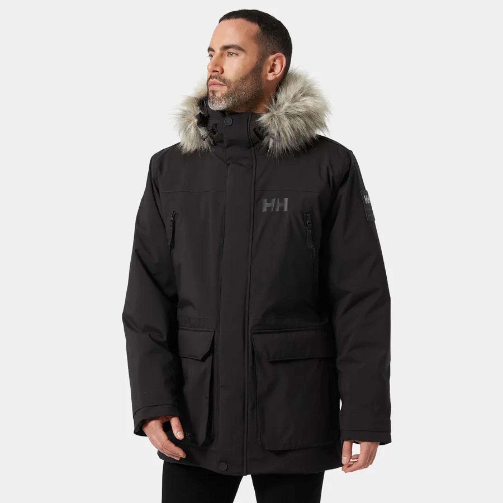 Male Model wearing the Helly Hansen Reine Parka in Black with the Hood Down