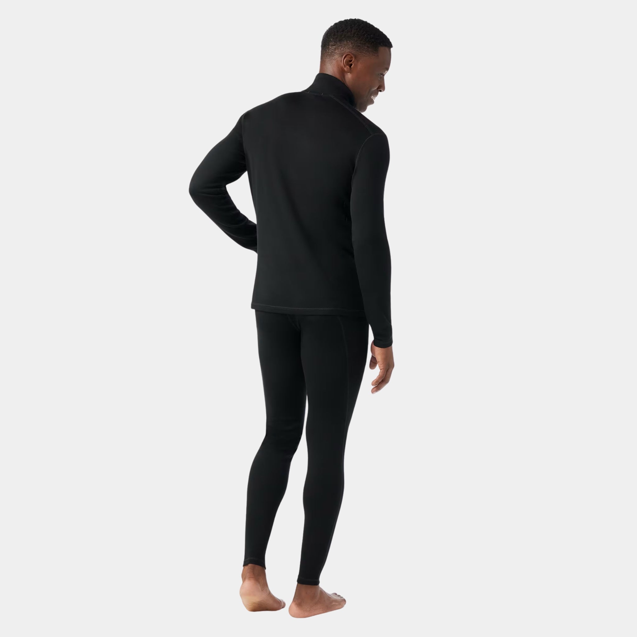 back view of a black Smartwool Men's Classic Thermal Merino Base Layer 1/4 Zip on a model for US Elite