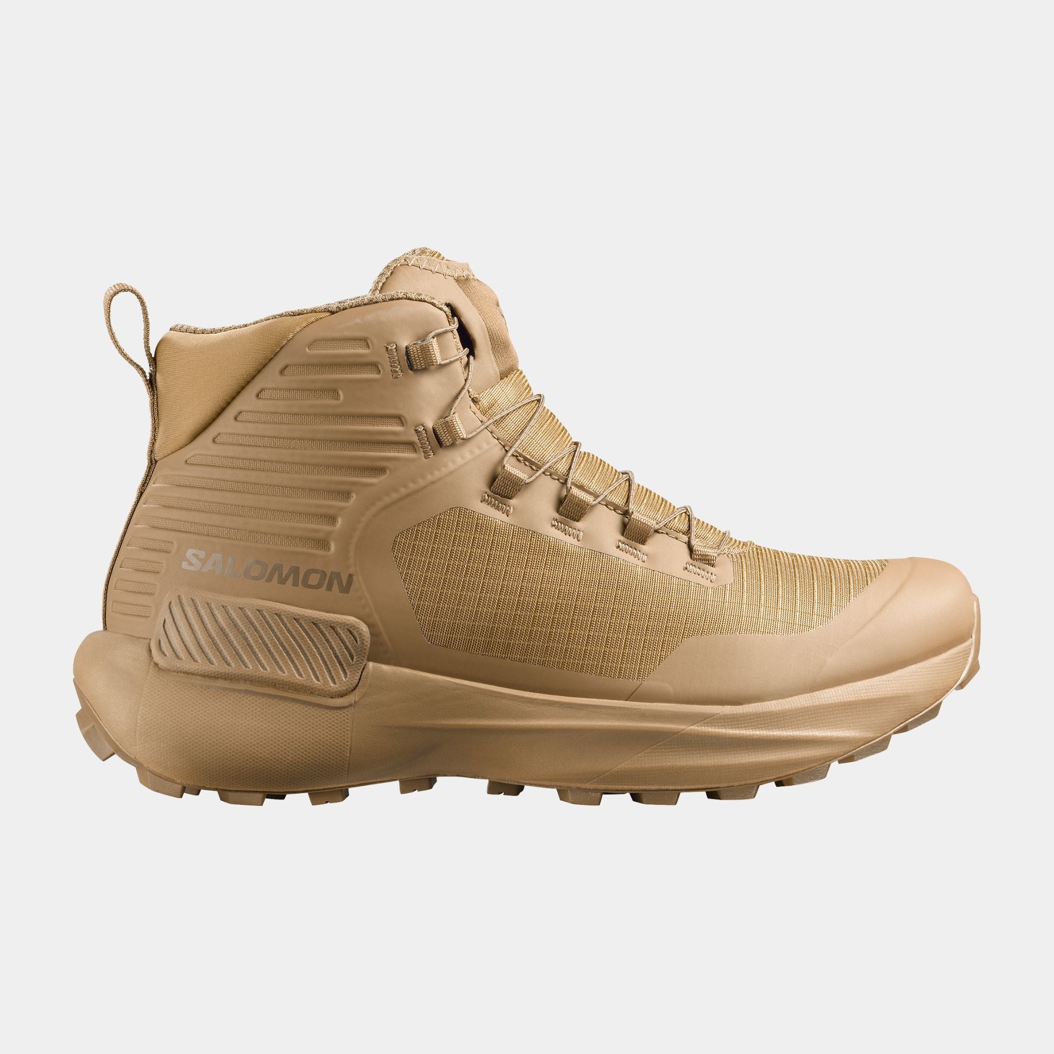A single Salomon mid-cut tactical boot in a uniform tan color, shown from a side profile view against a light gray background.