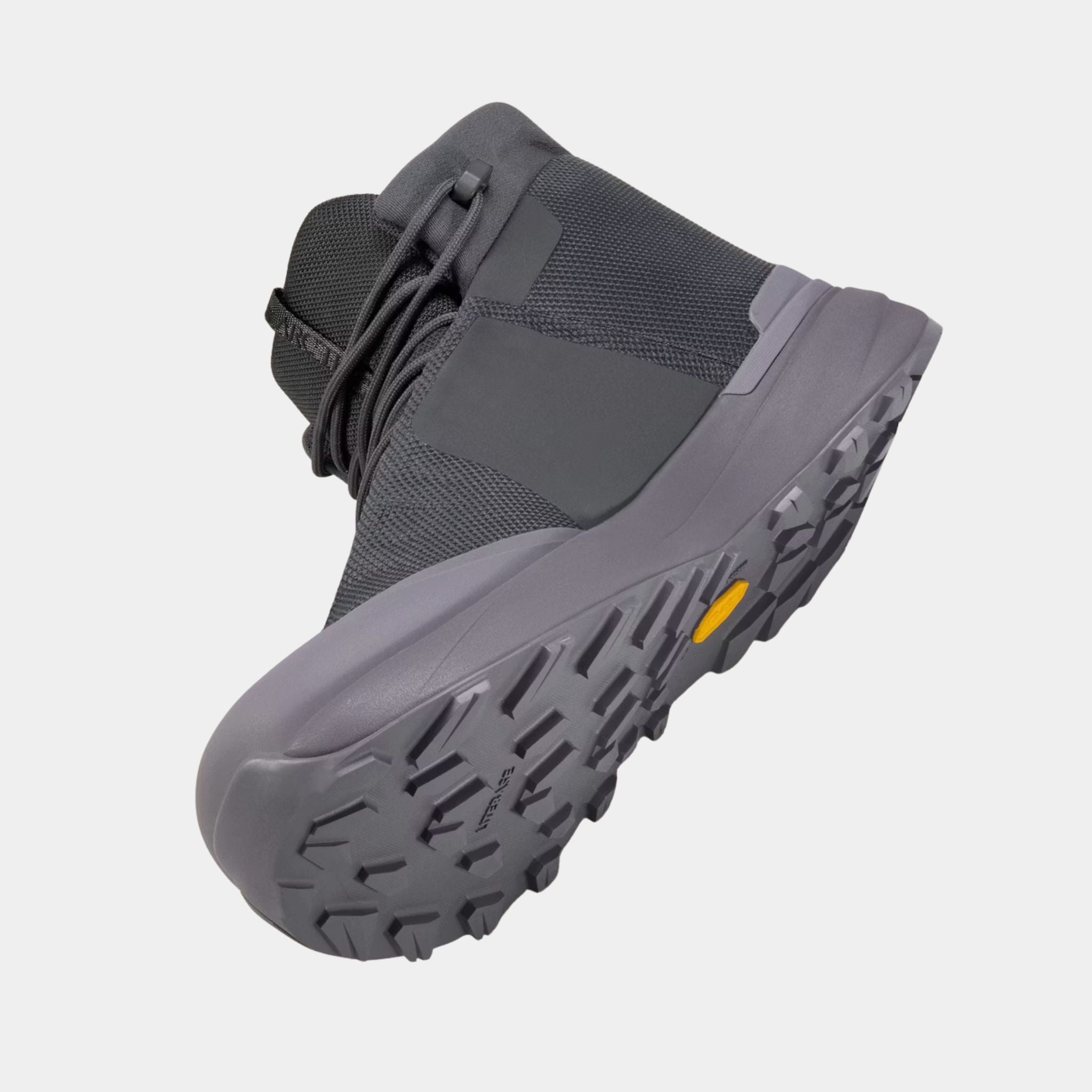 Angled side view of the Arc’teryx Kopec Mid GTX Boot highlighting the Vibram Soles